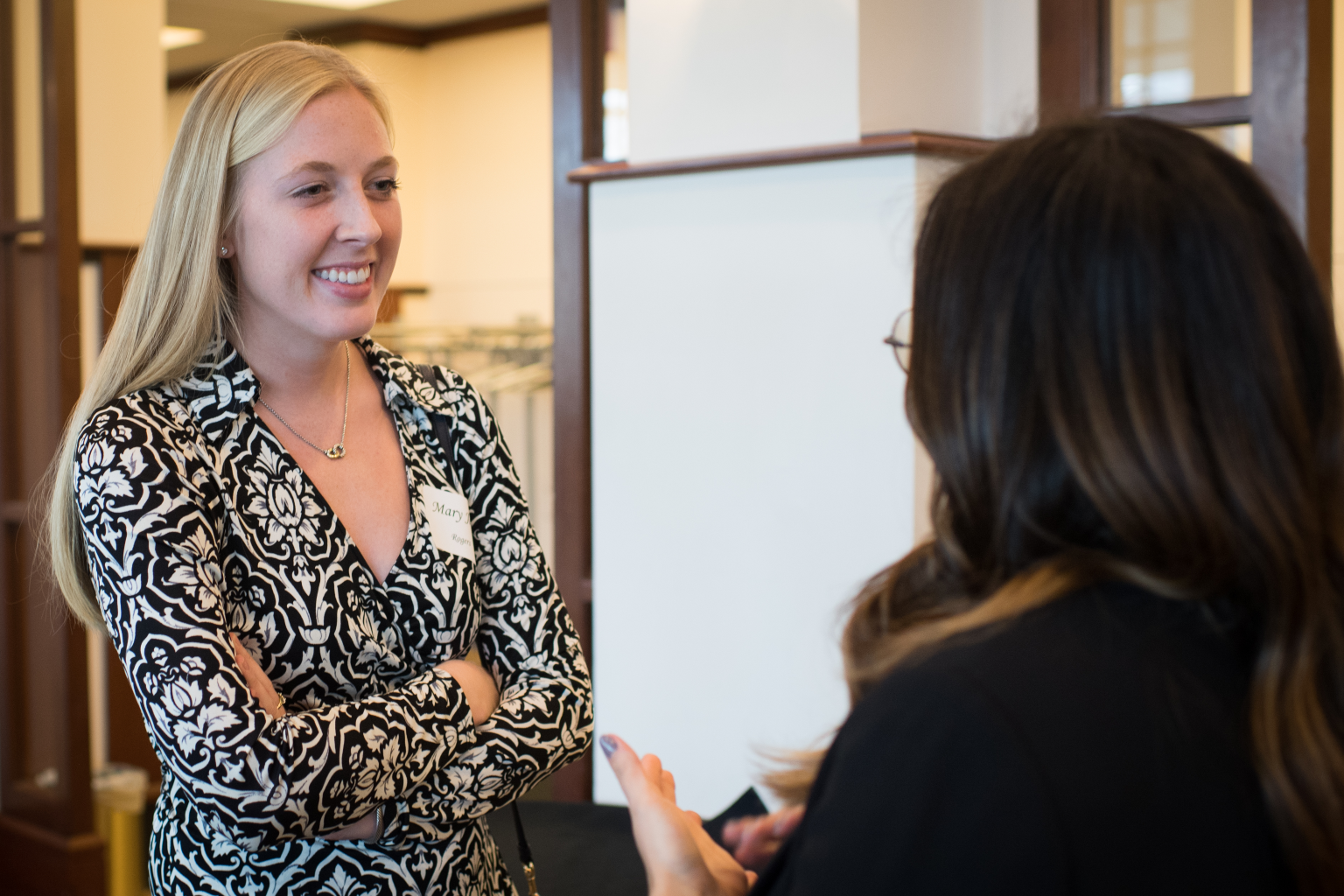 Photo of Novak Leadership Institute student consulting a peer.